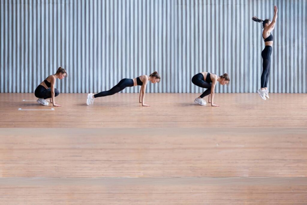 A woman is doing burpees