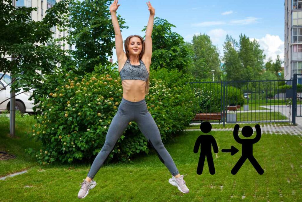 A woman is doing jumping jacks